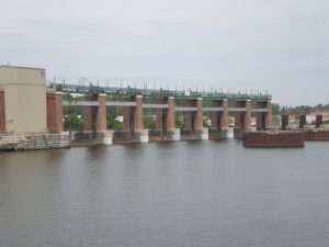 Distant view of the Lockport Controlling Works, featuring impressive columns that showcase the historical masonry and architectural design.