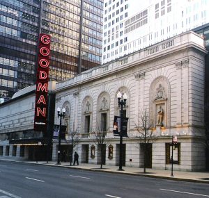 Front view of the Goodman Theatre showcasing its restored historical façade with intricate masonry details and limestone work.