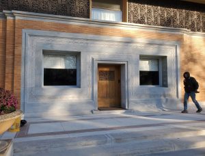 Close front view of the Winslow House, designed by Frank Lloyd Wright, highlighting its iconic symmetrical design and restored masonry details.